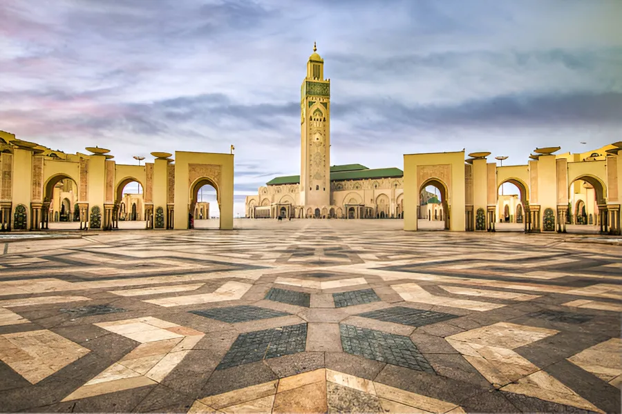 The Hassan II Mosque and its minaret above the marble plaza in Casablanca, day 1 of the 14-Day Morocco Tour from Casablanca: Morocco at Leisure