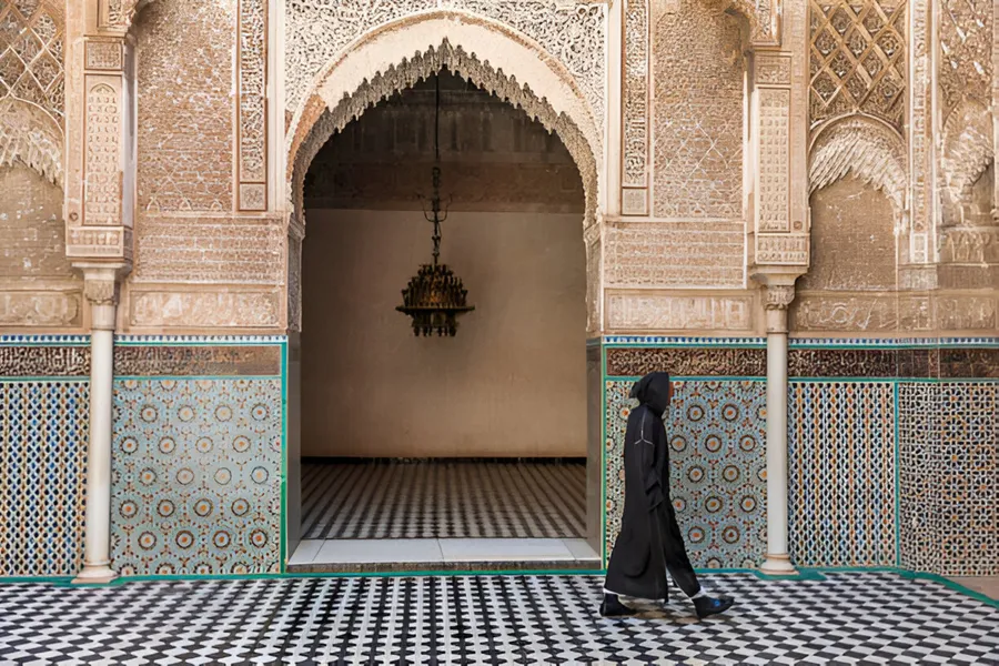 Carved stucco and zellige tiles in a medieval madrasa of the Fes medina, day 5 of the 14-Day Morocco Tour from Casablanca: Morocco at Leisure
