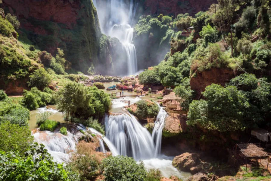 The Ouzoud waterfalls dropping into a green gorge in the Middle Atlas, day 2 of the Ouzoud Waterfalls Day Trip from Marrakech