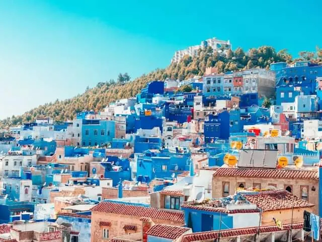 Blue houses of Chefchaouen below the Rif Mountains at the end of a 7-day Morocco tour from Marrakech via the Sahara desert