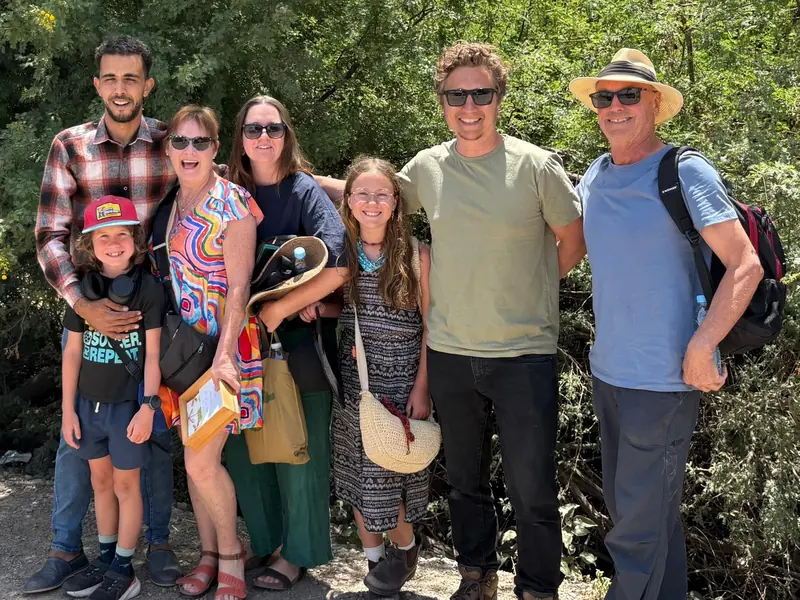 Family of travelers with their Camel Ride Trips driver-guide on a private Morocco tour